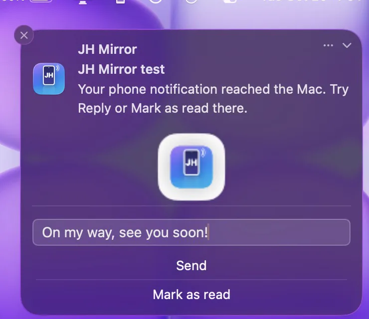 A phone notification on the Mac with a reply typed: On my way, see you soon!